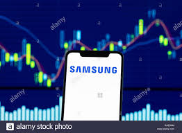 Samsung Logo Is Seen On An Android Mobile Phone Over Stock