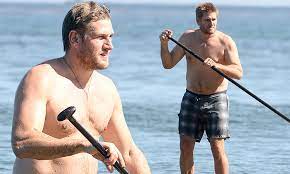 Curtis Stone reveals a rounder physique as he goes shirtless while  paddleboarding | Daily Mail Online