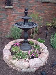 Clever way to hide a tree stump with images trees for front. 17 Tree Stomp Cover Ideas Garden Design Tree Stump Tree Stump Planter
