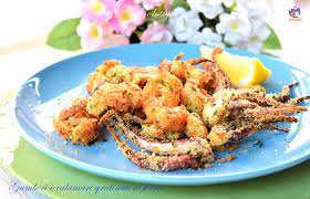 La soluzione ideale per far mangiare il pesce a grandi e piccini! Gamberi E Calamari Gratinati Al Forno Ricetta Buonissima E Leggera