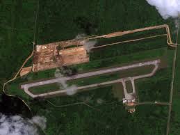 Satellite photos show how the US Air Force is reclaiming a WWII-era airfield  from the jungle to prepare to dodge Chinese missiles