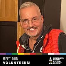 The correct answer is (c) thanks to. This is because the sentence is  expressing gratitude towards Anna Borovsky and the other organizer for  their efforts in making the community fund-raiser a success.