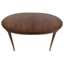 Crafted of walnut veneer, the table epitomizes the clean lines of modern design with a streamlined beveled top. Oval Midcentury Walnut Dining Table By White Furniture Company At 1stdibs