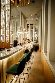 These black bamboo panels immediately create a tropical and cozy patio dining area. Add This Luxury Bar Lighting Fixtures Selection To Your Own Inspirations For Your Next Interior Design Projec Bar Interior Design Luxury Bar Modern Kitchen Bar