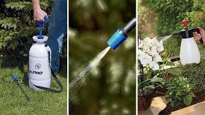 Homemade lawn sprayer constructed from a plastic drum, pump, hose, valves, and a small trailer. Garden Sprayer Buying Guide