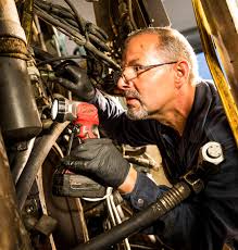 Plumber working on pipes