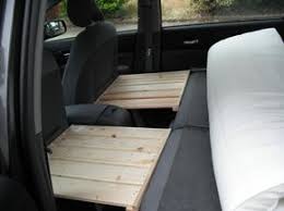 One Side Sits On The Headrest And The Other On The Hinged Legs Van De Camping Kangoo Camper Mini Camper