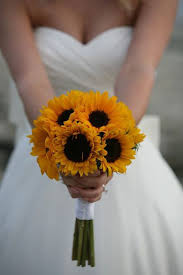 Blue is a bold color, but fortunately, with their shades ranging from purplesque to deep, rich blues, blue flowers go well with many other hues to create an interesting yet fetching bouquet. Sunflower Bridal Bouquet