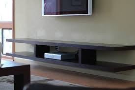 Black Wooden Floating Shelves Under Grey Tv On Grey Wall Floating Shelves Living Room Tv Wall Shelves Floating Shelves Diy