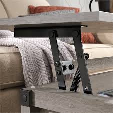 The top lifts up and forward creating a multipurpose work surface so you can work, browse online or eat dinner while relaxing on your couch. Sauder Carson Forge Lift Top Wood And Metal Coffee Table In Mystic Oak 426149