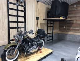 What you need is an attic lift that carries your heavy items up to the attic for you. Garage Storage Solutions Motorcycle Garage Lift In Manatee Fl Garage Evolution