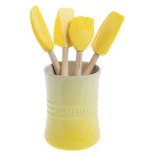 The le creuset silicone professional spoon spatula is perfect for a range of tasksin the kitchen, including scooping portions, scraping baked on food and breaking up dense ingredients. Le Creuset Craft Series Soleil Yellow Silicone Spatula Spoon With Wood Handle 11 3 8 L X 2 1 8 W