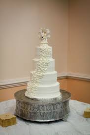 This could be funny if cupid had a compound bow and both bride and groom were struck by arrows of love or somesuch, but this 'bride murders groom' thing is over the top gross. Vintage Cake Topper On Classic Wedding Cake