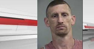 Louisville man accused of assaulting, robbing woman after car crash