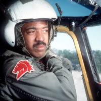 Co-pilot LT Gregory Gibson, of Helicopter Mine Countermeasures Squadron 14  (HM-14), lowers his visor while performing a pre-flight inspection