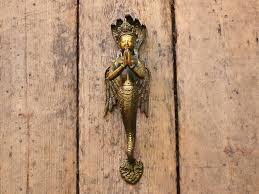 There are 19 mermaid door knocker for sale on etsy. Coffin Boffin En Twitter Mermaids I Got Serious Mermaid Envy From These Old Cuban Mermaid Door Knocker Balinese Winged Brass Mermaid Victorian Silver Neptune Mermaids Teach Me To Hear Mermaids Singing