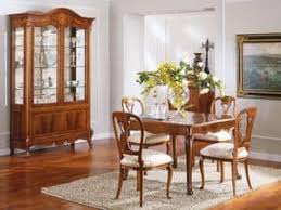 This dining room manages to be at once elegant and approachable, combining a friendly mix of details like its red brick fireplace, casual rug and refined upholstered dining chairs. Furniture Display Cabinets Idfdesign