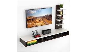 Their multi utilitarian feature makes the living room entertainment center, a storage unit and an organizer as well which makes everything easily accessible. Tv Unit Wall Mounted Tv Unit Designs To Incorporate In Living Room Most Searched Products Times Of India