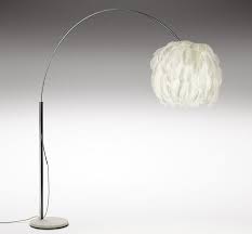 It is a decorative piece on its own, creating a focal point. Floor Standing Lamp Fiela Arc Haldane Martin Stainless Steel Original Design Adjustable
