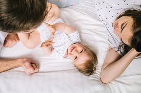Free Photo Young Couple With Baby In The Morning