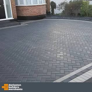 The sleek look of a well-maintained charcoal block paving driveway., AI generated