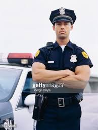 Portrait Of A Policeman Standing With His Arms Folded Lustig Polizei Polizist Manner Outfit