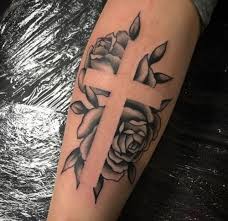 Many elements that can be added are crosses, butterflies, daggers, skulls, vines and even barbed wire. Roses And Cross Tattoo By Jonny Taylor 1920 Tattoo