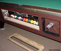 how does the ball return work on a coin operated pool table