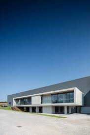 Ana Coelho Adds Elevated Concrete Volume To Host Office Spaces In Portuguese Factory Office Space Industrial Office Space Architecture