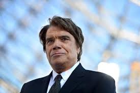 Bernard tapie (born january 26, 1943 in paris) is a french businessman, politician and occasional actor, singer, and tv host. French Tycoon On Trial Over Us 450 Million Arbitration Deal World China Daily