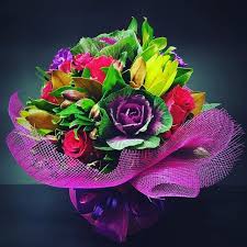 An Arrangement Including Kale Roses Leucadendron Alstroemeria And Stock Flower Arrangements Flowers Bouquet Arrangements