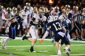 Football: McElhaney scores 4 TDs, Summit takes Border Battle