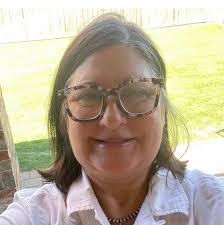 Who can cut a wig with bangs and shape it around the face?