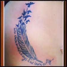 Commonly the feather designs mean: The Famous Bird Feather Tattoo With A Twist Of Autumn Style Love Thebeatles Lyrics Feather Tattoos Tattoos Bird Tattoo Back