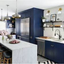 Natural light collides with the white upper cabinets, backsplash and counters, keeping the space bright. Navy Blue Kitchen Cabinets Ideas Novocom Top