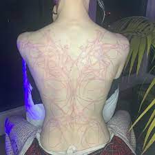 The design was created using white ink and is (we think) supposed to look as Pop Crave On Twitter Grimes Shows Off New Alien Scars Tattoo