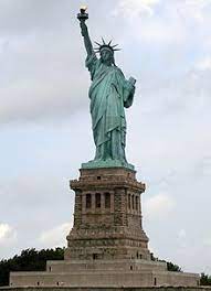 The statue of liberty inscription, the torch held in lady liberty's hands, the crown with seven spikes and the position of the feet, etc. Statue Of Liberty Wikiquote
