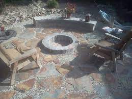 Building a beautiful stone fire pit for the backyard is a project almost anybody can handle with a little help from the diynetwork.com experts. Fire Pit Area Gravel And Slate Are In Brick And Mortar Work Is Done On Bench And Pit Next Facing Stone For Bench A Fire Pit Area Yard Project Outdoor Spaces