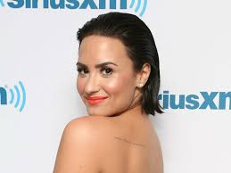 Demi Lovato tells fans to love their curves in legs-for-days Instagram pic