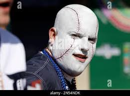 George Uhl, of Sterling Heights, Mich., is made up to look like a baseball  before a baseball game between the Detroit Tigers and the Kansas City  Royals in Detroit, Monday, March 31,