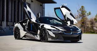 Bmw I8 Gets Eye Catching Camo Wrap Design Carscoops Bmw I8 Bmw Luxury Cars Bmw