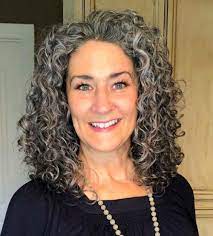 15 Women Who Ve Embraced Their Curly Gray Hair And Love It Fabulous After 40 Grey Curly Hair Curly Hair Styles Curly Hair Styles Naturally