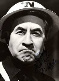 Bill Pertwee as that classic British tv character ' You love to hate '. ARP  Warden Hodges, from Dads Army. While it's true that Bill Pertwee's Warden  may have given people the