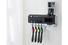 Arrange in a tray of other vanity utilities such as hair combs, soap pumps, shaving cream and tissue boxes, or position it alone next to the sink. Toothbrush Sanitizer Toothbrush Sterilizer And Holder With Led Uv Light Sterilization Function Wall Mounted Automatic Toothpaste Dispenser Black Kogan Com