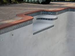 The pool coping is used to separate the pool structureom the poolcking. Inground Concrete Pool Renovations For Delaware