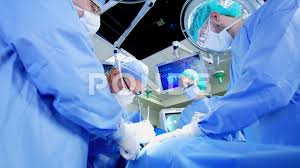 Surgical Healthcare Medical Training Team In Scrubs Working In Modern Hospital Stock Footage Training Team Medica Medical Training Health Care Modern Hospital