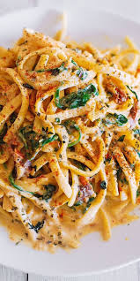 Linguine Pasta With Spinach And Sun Dried Tomato Cream Sauce Tomato Cream Sauces Food Recipes