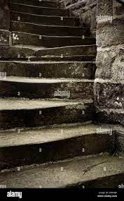 Stone steps winding up the side of old building Stock Photo - Alamy