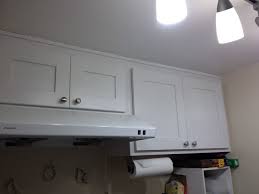 But we love the idea of using contrast with the existing material and contact paper (even standard white!). Spruce Up The Outside Of Your Kitchen Cabinets With Contact Paper Offbeat Home Life