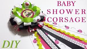 You can choose either fresh or silk flowers or you can make a bouquet out of baby socks. Como Hacer Lazos Diy 119 Baby Shower Corsage Tutorial Youtube